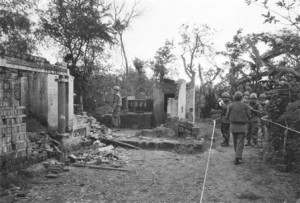 American soldiers look over the remains of a home in My Lai, South Vietnam in this January 8, 1970 file photo. The GIs are in a safe area marked off with white tape, having been swept for booby-traps that have already wounded five soldiers since the investigation of the killing of unarmed civilians by members of the U.S. Army - what would come to be called The My Lai Massacre - began. (AP Photo/File)